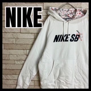 ナイキ(NIKE)のNIKE パーカー プルオーバー スウェット 花 木 梅 桜 模様 スポーツ(パーカー)