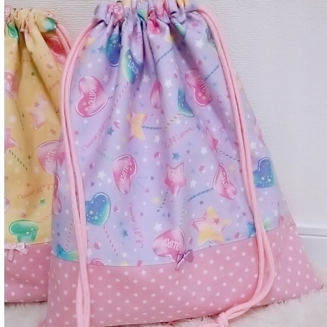 【ましろさま専用】お着替え袋　巾着袋　ロリポップイエロー&パープル キッズ/ベビー/マタニティのこども用バッグ(体操着入れ)の商品写真