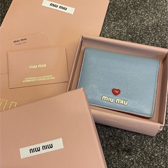 MIU MIU マドラスラブ ブルー 二つ折り財布 特別セーフ 5202円引き www ...