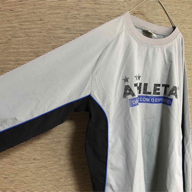 ATHLETA(アスレタ)の【アスレタ】ピステ　シャカシャカ　長袖　スポーツウェア　サッカー　デカロゴ45 スポーツ/アウトドアのサッカー/フットサル(ウェア)の商品写真