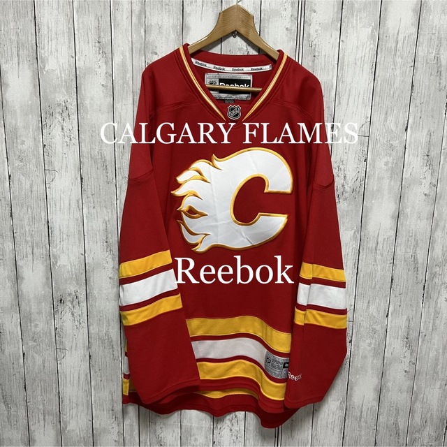 Reebok(リーボック)の美品！NHL Reebok×CALGARY FLAMES ゲームシャツ！  スポーツ/アウトドアのスポーツ/アウトドア その他(その他)の商品写真