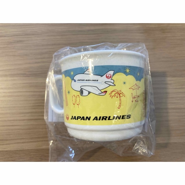 JAL(日本航空)(ジャル(ニホンコウクウ))の【JAL】非売品　機内ノベルティ　コップ巾着セット(黄色) エンタメ/ホビーのコレクション(ノベルティグッズ)の商品写真