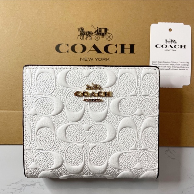 COACH シグネチャー エンボス加工 2つ折り財布 ホワイト - 財布