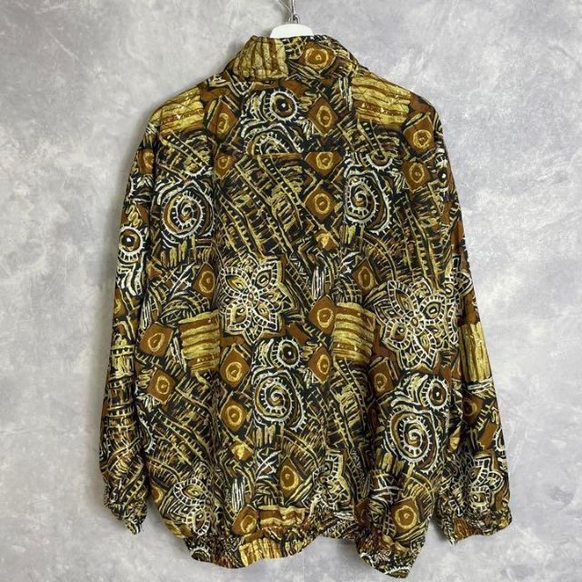 ビンテージ総柄デザインジャケット 90s ベージュ フルジップ 民族柄 メンズのジャケット/アウター(ナイロンジャケット)の商品写真