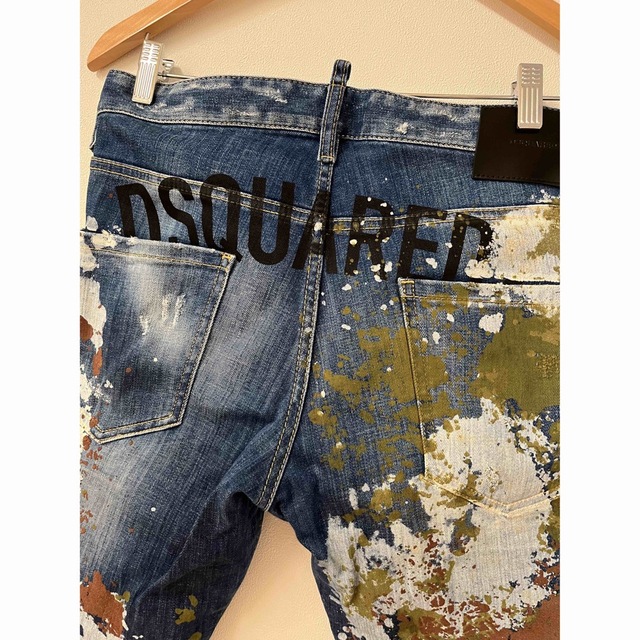 DSQUARED2(ディースクエアード)のDSQUARED2 ペイント ダメージ加工 ボタンフライ  COOLGUY メンズのパンツ(デニム/ジーンズ)の商品写真