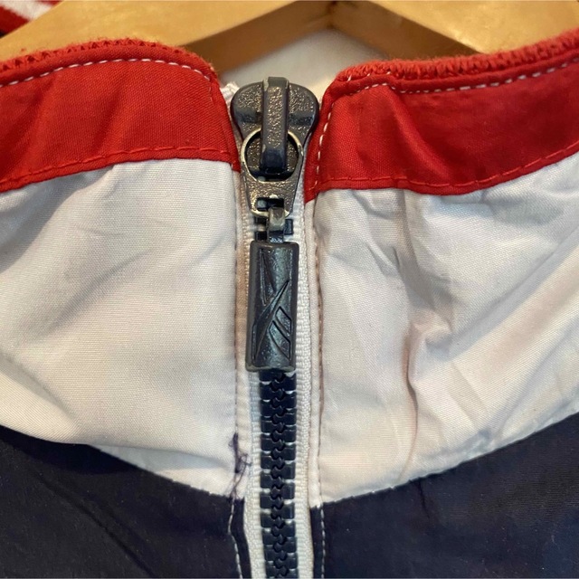 Reebok(リーボック)の《リーボック》90s ナイロンジャケット 刺繡ロゴ 万国旗タグ マルチカラー メンズのジャケット/アウター(ナイロンジャケット)の商品写真