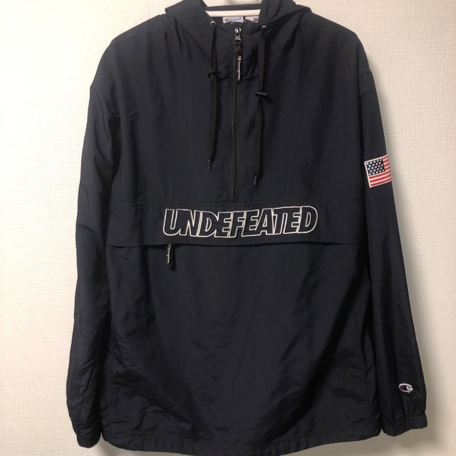 UNDEFEATED(アンディフィーテッド)のundefeted champion コラボアノラック メンズのジャケット/アウター(ナイロンジャケット)の商品写真