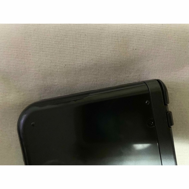 NEW Nintendo 3DS LL本体 メタリックブラック　充電器付き エンタメ/ホビーのゲームソフト/ゲーム機本体(携帯用ゲーム機本体)の商品写真