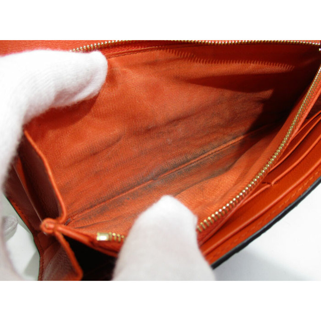 Gucci(グッチ)のGUCCI 二つ折り長財布 GGマーモント パイソン レザー オレンジ ブラック レディースのファッション小物(財布)の商品写真