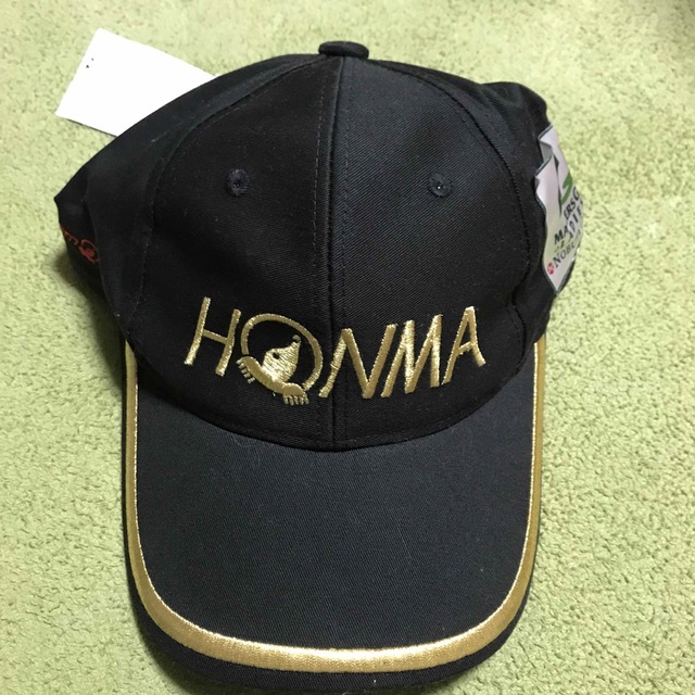 本間ゴルフ(ホンマゴルフ)の新品　本間ゴルフ　黒ゴールド　キャップ メンズの帽子(キャップ)の商品写真