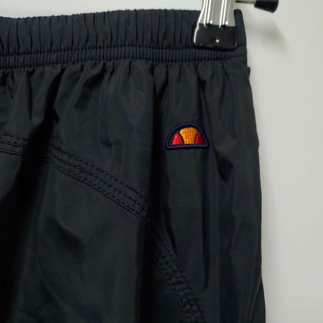 ellesse(エレッセ)のエレッセ ウインドブレーカー パンツ  S ブラック ETL61301 レディース ウォームアップ テニス ウェア スポーツ/アウトドアのトレーニング/エクササイズ(その他)の商品写真