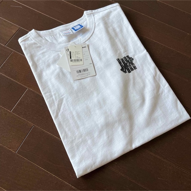 UNDEFEATED(アンディフィーテッド)のUNDEFEATED CHAMPION TEE - C8-V321 XL メンズのトップス(Tシャツ/カットソー(半袖/袖なし))の商品写真