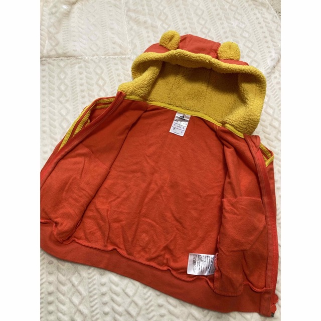 adidas(アディダス)の【adidas】パーカー　90センチ　プーさん　オレンジ キッズ/ベビー/マタニティのキッズ服女の子用(90cm~)(その他)の商品写真