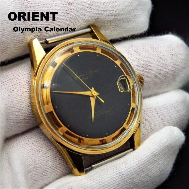 ORIENT(オリエント)のOLYMPIA CALENDAR SWIMMER 手巻き腕時計 変わり文字盤 メンズの時計(腕時計(アナログ))の商品写真