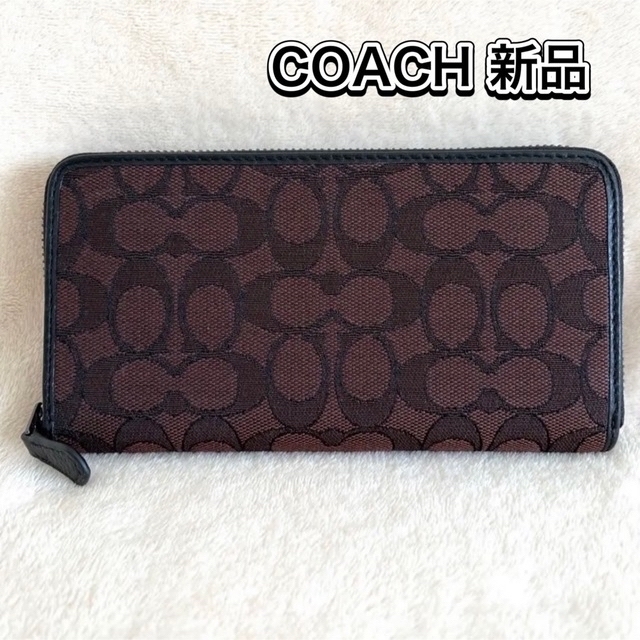 【新品】【残り僅か】COACH コーチ 人気のシグネチャー柄のブラウンの財布です