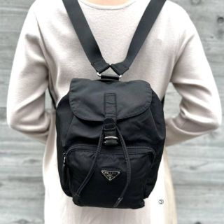 PRADA ミニリュック ナイロン 三角プレート 巾着 ブラック 白タグ | フリマアプリ ラクマ