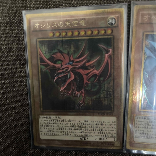 遊戯王(ユウギオウ)の遊戯王　三幻神　ミレニアムゴールドレア（2重スリーブ入り） エンタメ/ホビーのアニメグッズ(カード)の商品写真