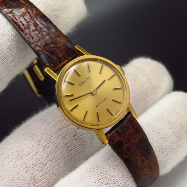 TISSOT - TISSOT STYLIST 手巻き腕時計 ゴールド文字盤 TISSOT - TISSOT STYLIST 手巻き腕時計 ゴールド文字盤