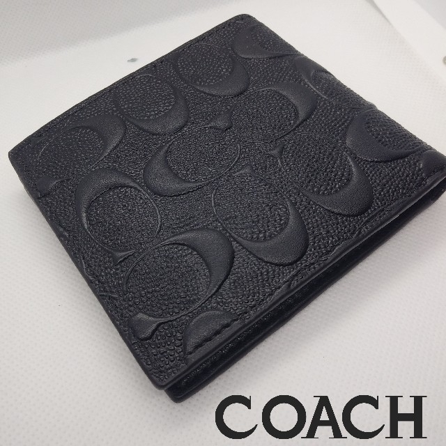 COACH(コーチ)のCOACH高級感有りコーチ小銭入れ有りブラックエンボスシグネチャーコンパクト財布 メンズのファッション小物(折り財布)の商品写真