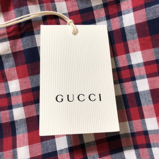 Gucci(グッチ)の新品未使用　GUCCI グッチチルドレンズ　GUCCIロゴプリントチェックシャツ レディースのトップス(シャツ/ブラウス(長袖/七分))の商品写真