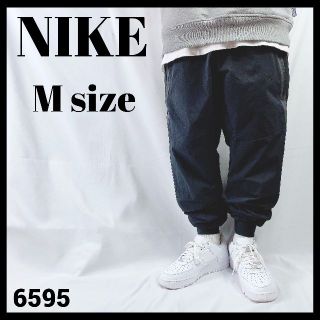 ナイキ(NIKE)のNIKE ナイキ ジョガーパンツ ナイロン製パンツ ブラック 黒 赤タグ M(その他)