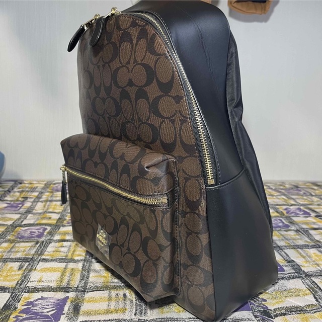 COACH(コーチ)の美品✨コーチ　リュック　シグネチャー　レザー　ブラウン×黒　PVC 大容量 レディースのバッグ(リュック/バックパック)の商品写真