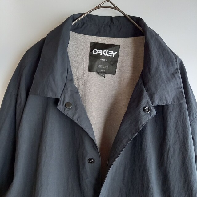 Oakley(オークリー)のオークリー　ナイロン　コーチジャケット　ビッグロゴ　ブラック　2XL メンズのジャケット/アウター(ナイロンジャケット)の商品写真