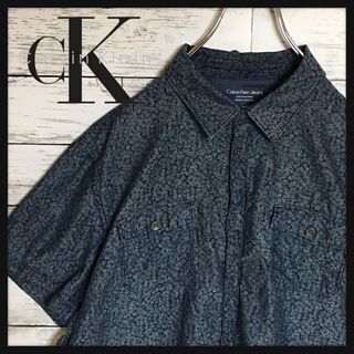 カルバンクライン(Calvin Klein)の【美品】カルバンクラインジーンズ　半袖花柄シャツ　人気ネイビーL E301(シャツ)