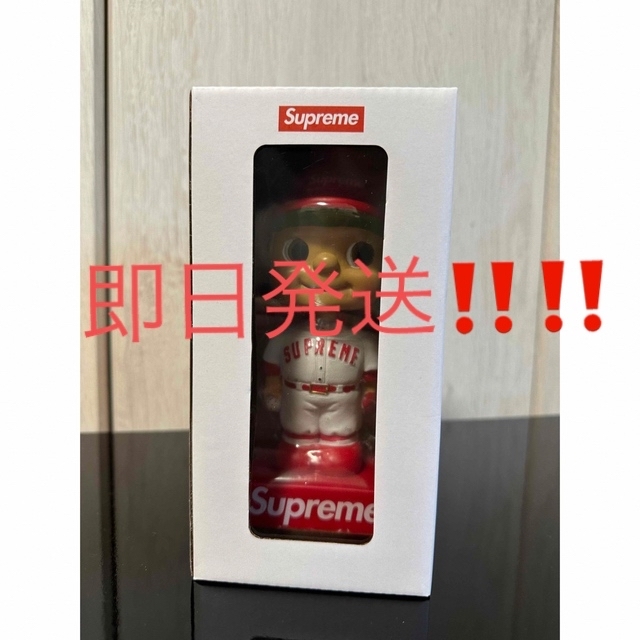 Supreme Bobblehead red