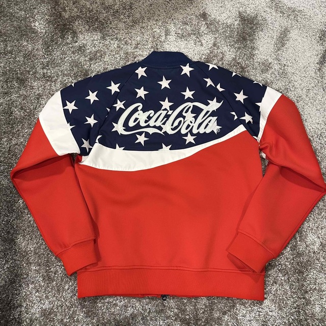 F.C.R.B.(エフシーアールビー)のFCRB COCA-COLA 20SS PDK JACKET  コカコーラ メンズのトップス(ジャージ)の商品写真