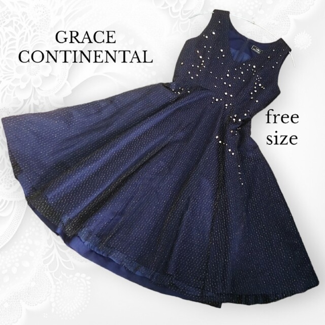 GRACE CONTINENTAL(グレースコンチネンタル)の美品 グレースコンチネンタル プラネットワンピース ドレス 紺 ラインストーン レディースのフォーマル/ドレス(ミディアムドレス)の商品写真