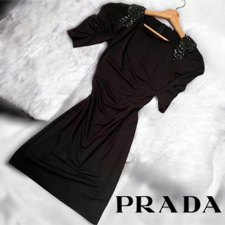 プラダ(PRADA)の【美品】PRADA ブローチドレスロングワンピース　希少　黒　現行　38サイズ(ロングワンピース/マキシワンピース)