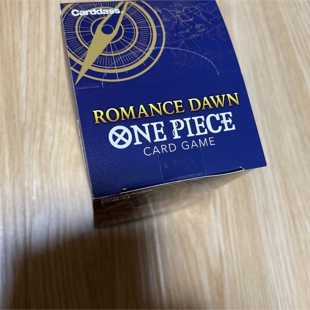 ONE PIECE(ワンピース)の新品未開封品　ワンピース カードゲーム ROMANCE DAWN 1箱　テープ付 エンタメ/ホビーのトレーディングカード(Box/デッキ/パック)の商品写真