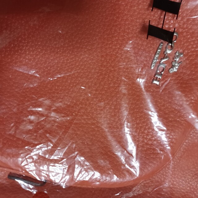COACH(コーチ)のCOACH　オレンジリュック　コーラルピンク　新品未使用　バックパック レディースのバッグ(その他)の商品写真