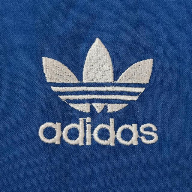adidas(アディダス)のアディダス トレファイルロゴ刺繍トラックジャケット L ブルー 水色 白 古着 レディースのトップス(その他)の商品写真
