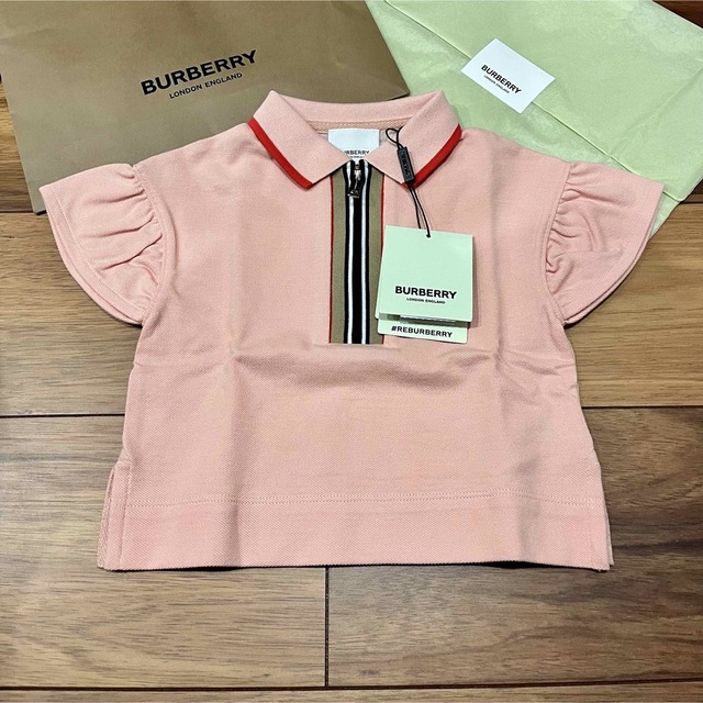 BURBERRY(バーバリー)のアイコンストライプ　ピンク　フリル　ポロシャツ　ブラウス　Tシャツ　半袖 キッズ/ベビー/マタニティのベビー服(~85cm)(Ｔシャツ)の商品写真