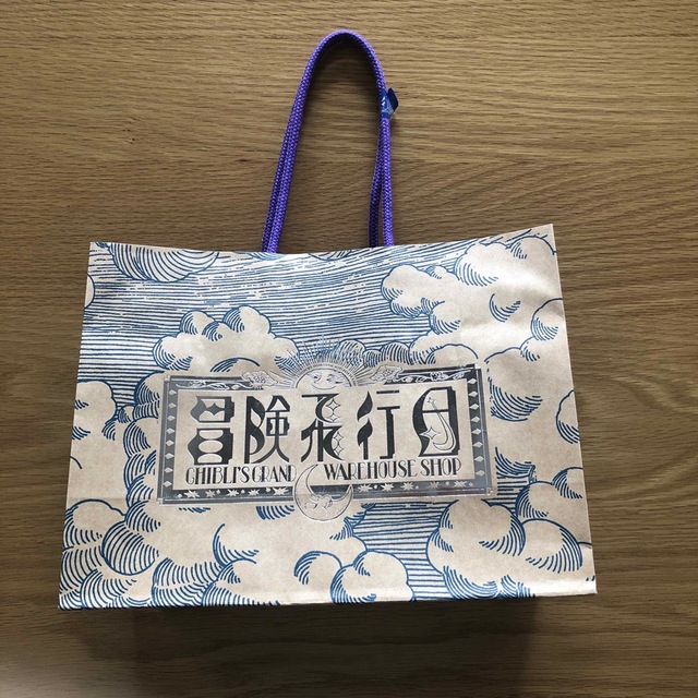 ジブリ(ジブリ)の紙袋　冒険飛行日　 レディースのバッグ(ショップ袋)の商品写真
