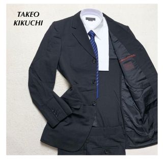 タケオキクチ(TAKEO KIKUCHI)の【美品】新品価格5.8万円 タケオキクチ セットアップスーツ ウール95％ 黒色(セットアップ)