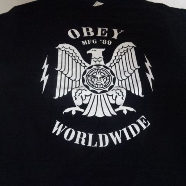 OBEY(オベイ)のUSA購入【OBEY】USA国鳥 白頭鷲 ロゴイラストプリントTシャツUS L黒 メンズのトップス(Tシャツ/カットソー(半袖/袖なし))の商品写真