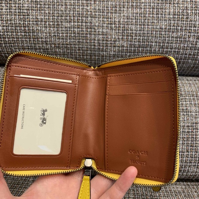 COACH(コーチ)の869  コーチ　二つ折り財布　スヌーピーコラボ レディースのファッション小物(財布)の商品写真