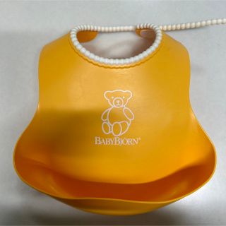 ベビービョルン(BABYBJORN)のBABYBJORN  お食事エプロン　イエロー(お食事エプロン)