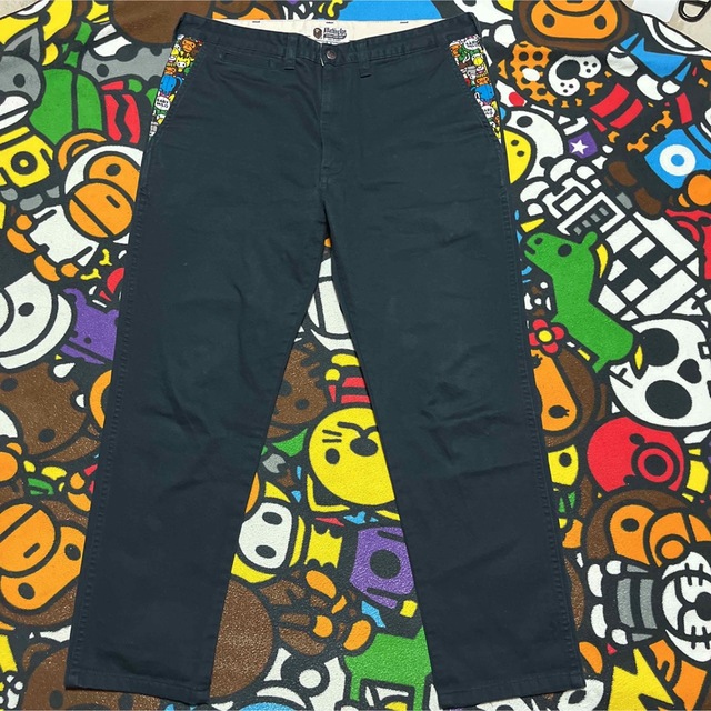 A BATHING APE - APE BAPE KAWS BABY MILO チノパン パンツ Lの通販 by