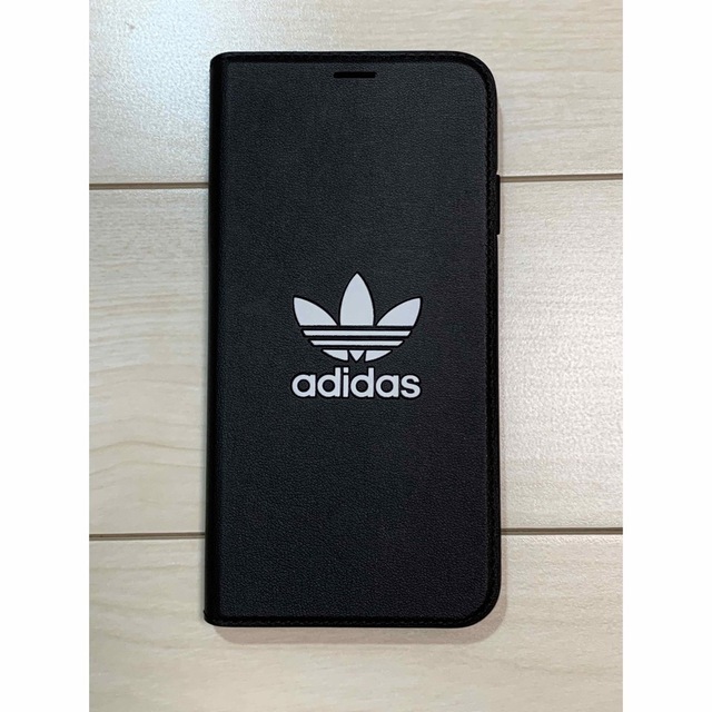 adidas(アディダス)のアディダス iPhone Xs Max トレフォイル 手帳型 ブラック スマホ/家電/カメラのスマホアクセサリー(iPhoneケース)の商品写真