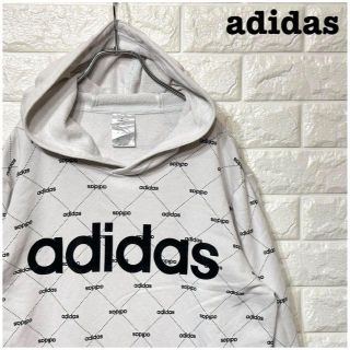 アディダス(adidas)のデカロゴアディダスadidas プルオーバーパーカー 総柄 オーバーサイズ 白(パーカー)