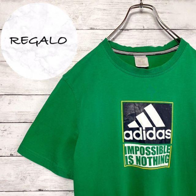 adidas(アディダス)の【アースカラー】アディダス　グリーンボックスプリントロゴTシャツ メンズのトップス(Tシャツ/カットソー(半袖/袖なし))の商品写真