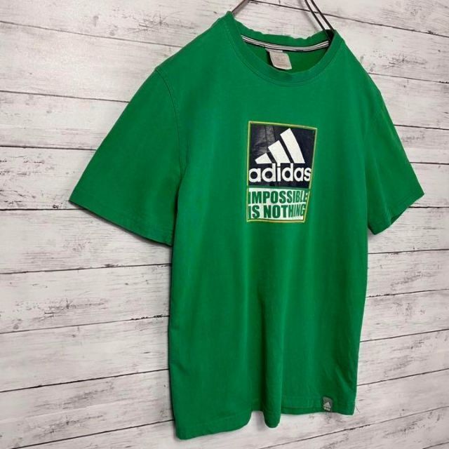 adidas(アディダス)の【アースカラー】アディダス　グリーンボックスプリントロゴTシャツ メンズのトップス(Tシャツ/カットソー(半袖/袖なし))の商品写真