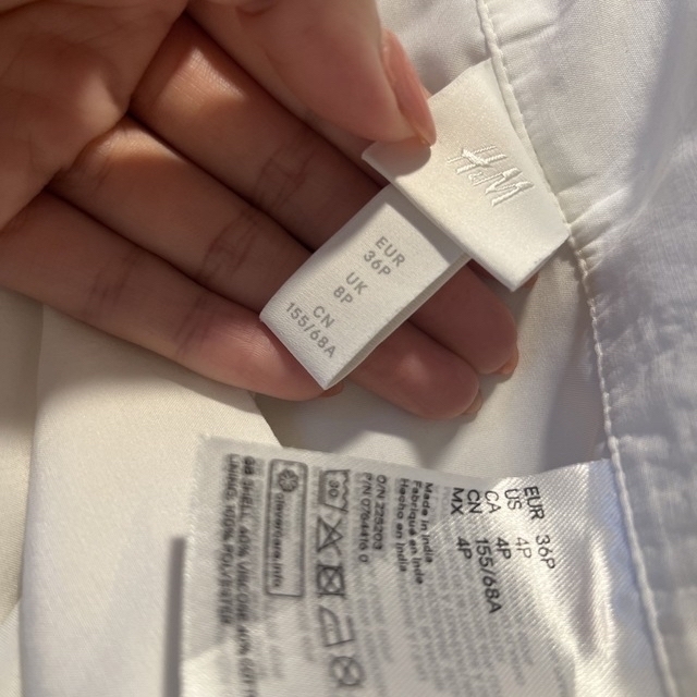 H&M(エイチアンドエム)のh&m スカート　白　ホワイト　ボタン レディースのスカート(ロングスカート)の商品写真