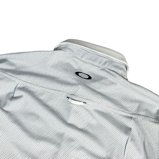 Oakley(オークリー)のOAKLEY オークリー  長袖　ポロシャツ 総柄 ホワイト スポーツ/アウトドアのゴルフ(ウエア)の商品写真
