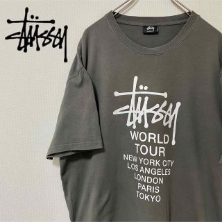 ステューシー(STUSSY)の海外古着！Stussy オーバーサイズワールドツアーTダークグレー(XL)(Tシャツ/カットソー(半袖/袖なし))