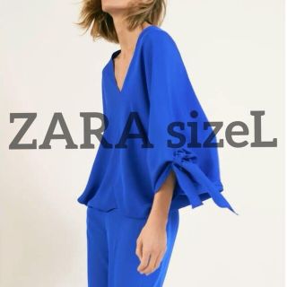 ザラ(ZARA)の新品タグ付きZARAsizeL タイリボン付きボリューム袖トップス(シャツ/ブラウス(長袖/七分))